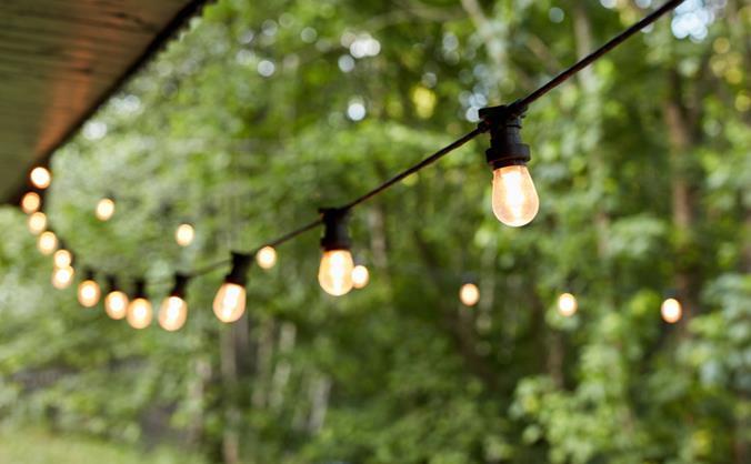 string lights hanging from a roof overhang